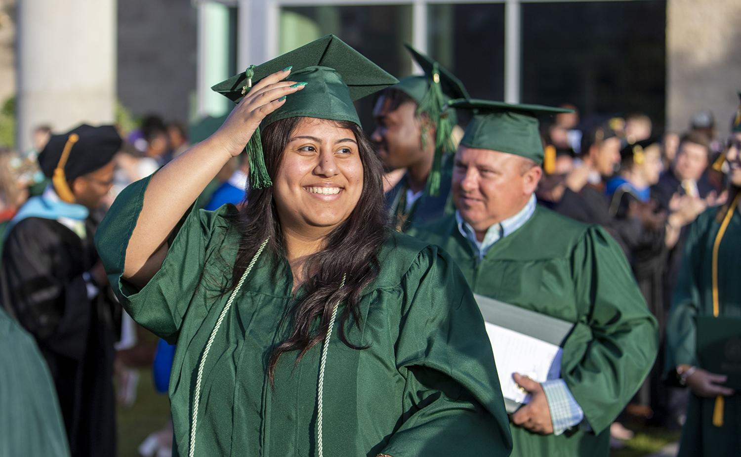 smiling graduate in group